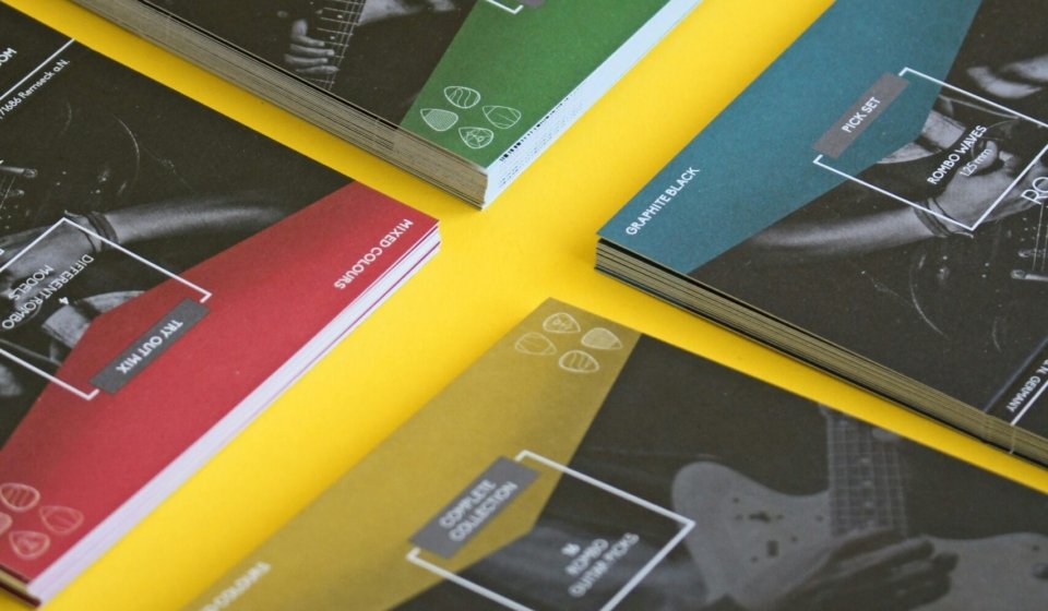 black and orange book on yellow table